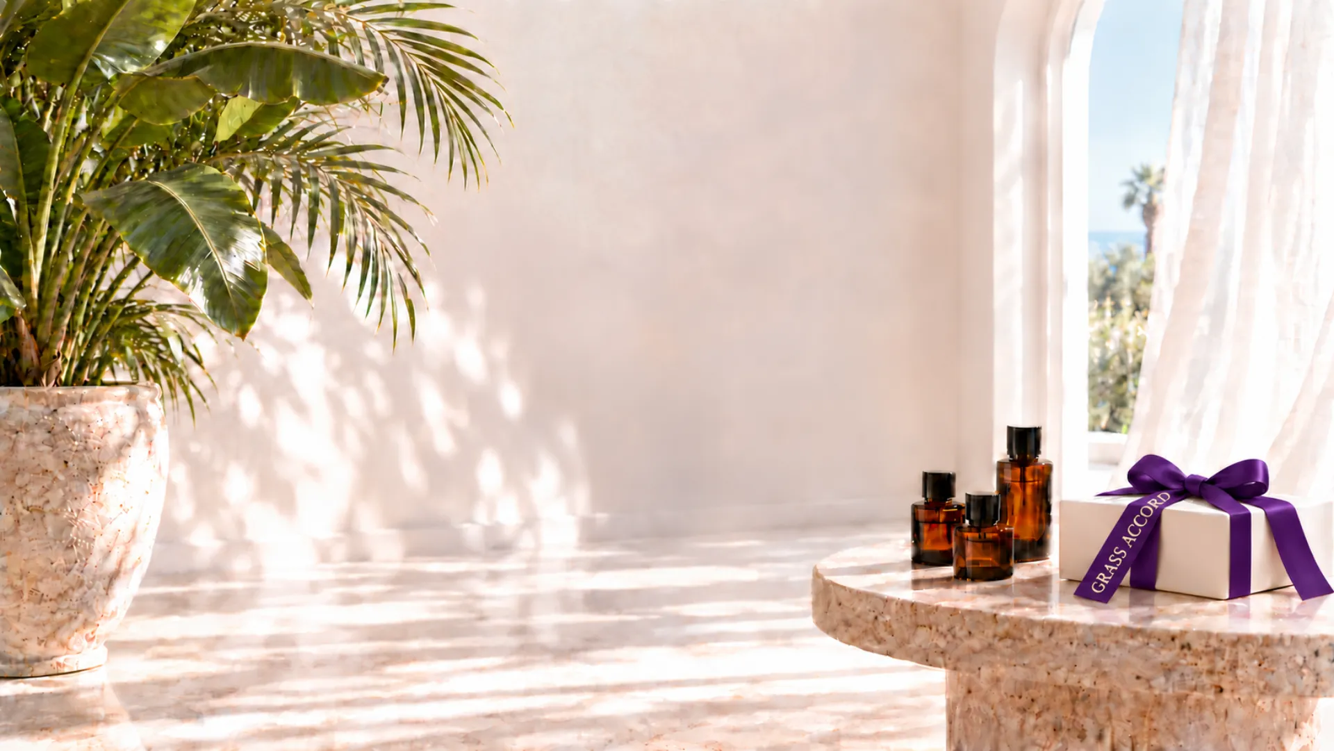 A bright white perfumery maison with amber bottles, tropical plants and an ivory gift box tied with a purple GrassAccord ribbon
